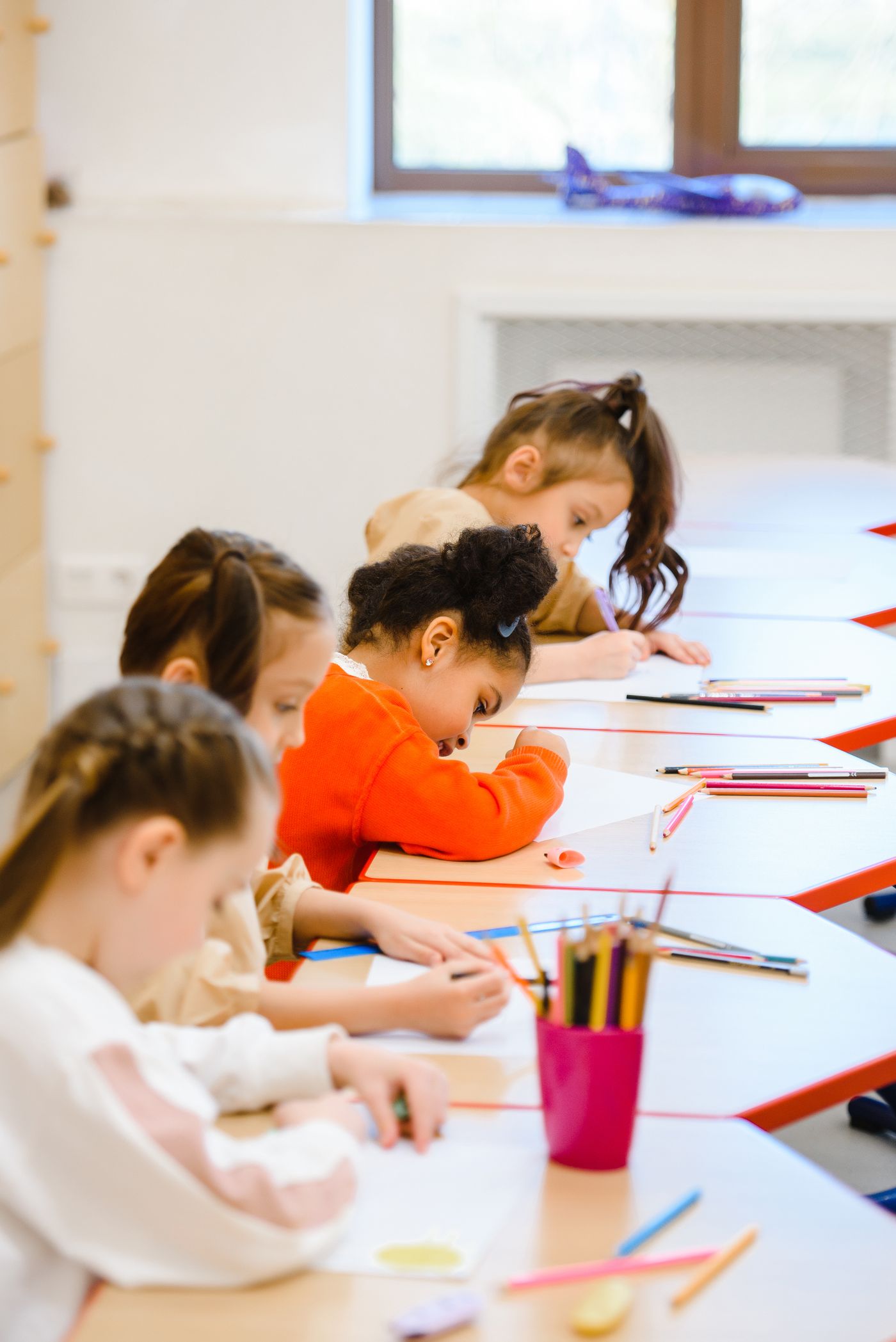 Children working on their own writing in a classroom